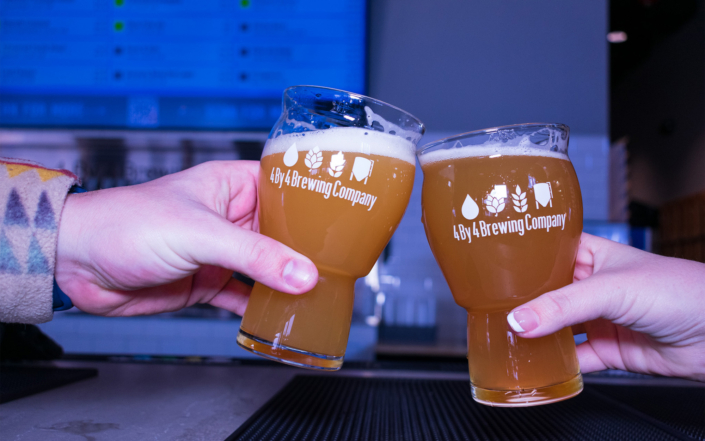 People Clinking 4 By 4 Brewing Company Glasses