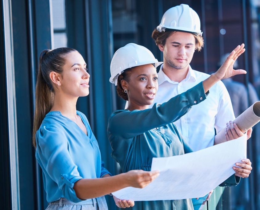 Architects Wearing Hard Hats Looking at Site