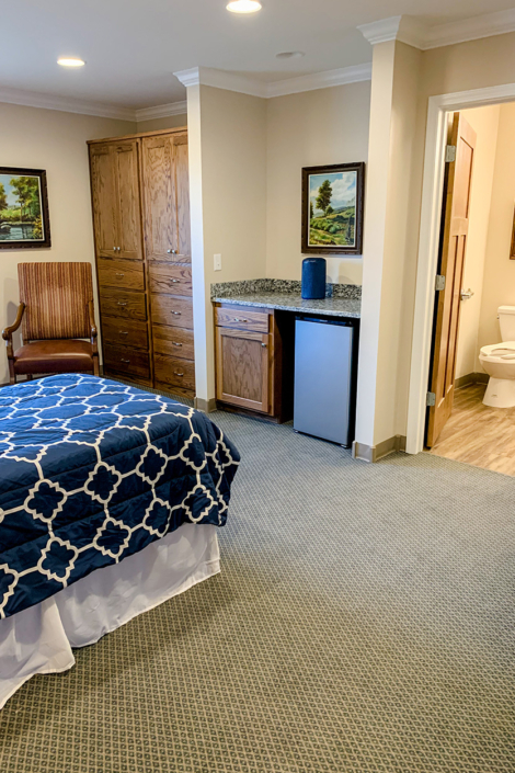Century Pines Room with view of bed and bathroom