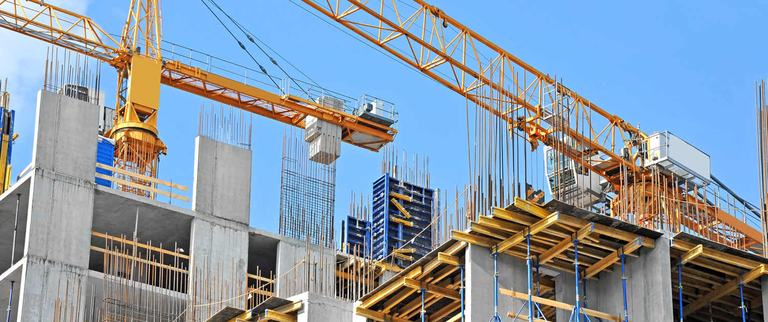 Cranes on Building Roof Working on Project