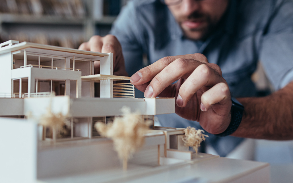 Architect Building a model of home with wood