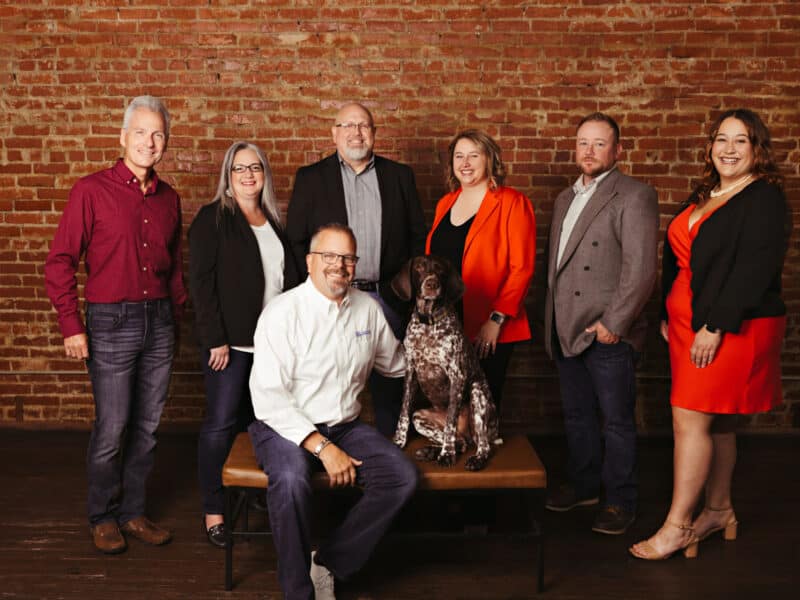 Torgerson Leadership Team in front of a brick wall