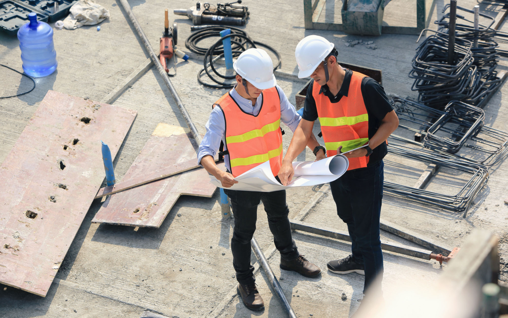 Aerial view of two engineers work on the construction site