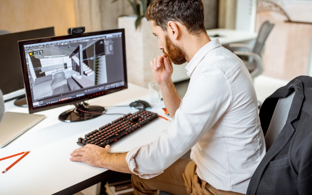 Engineer working on digital model of building