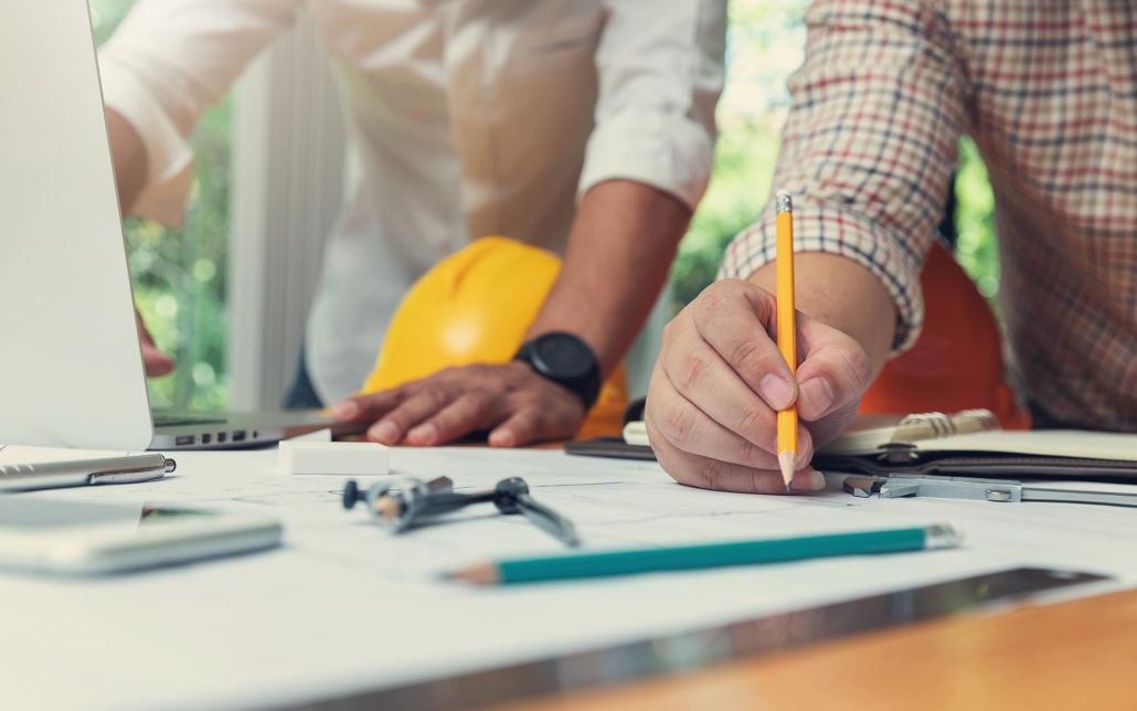 Engineers working on plan for commercial building remodel