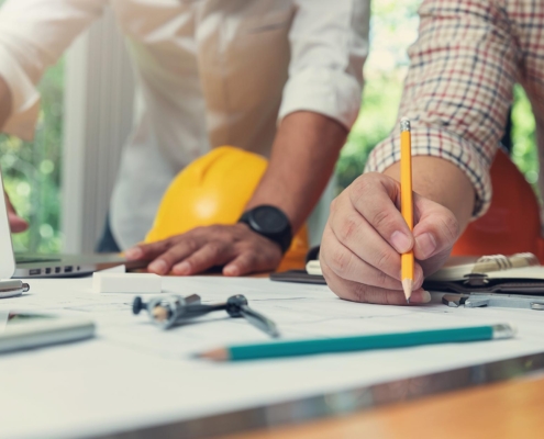 Engineers working on plan for commercial building remodel